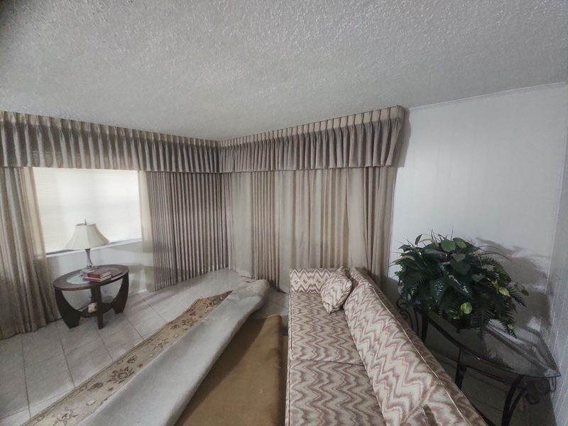 After restoration: living room tile and rug dry-out on a documented Hollywood, FL restoration project by Restoration Doctor.