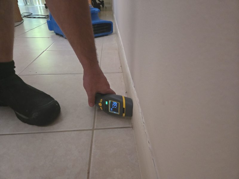 Miami, FL home after documented tile floor water extraction, final baseboard moisture check