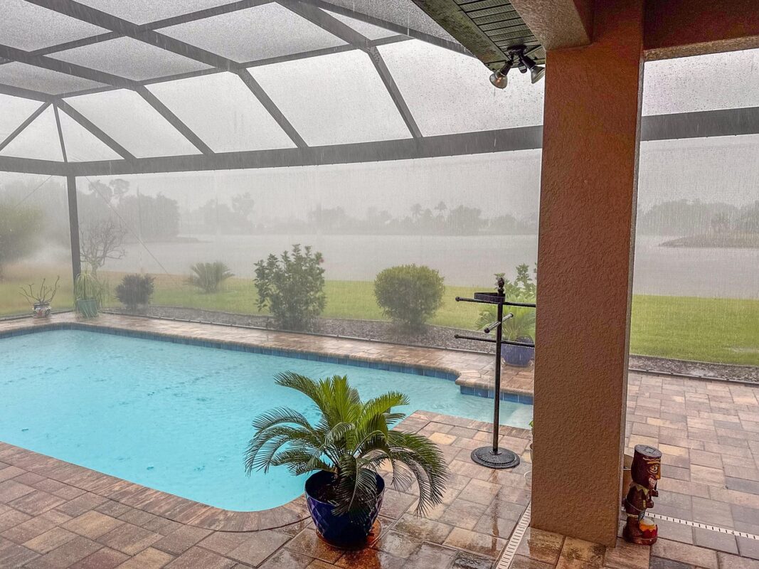 Lanai area with pool in Florida on a rainy day